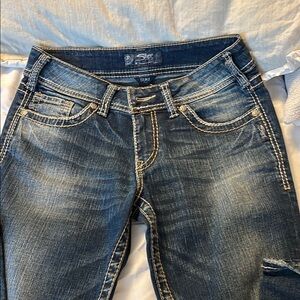 Silver Jeans Blue Boot Cut Denim with Distressed Details